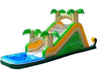 A large inflatable slide with palm trees on it.