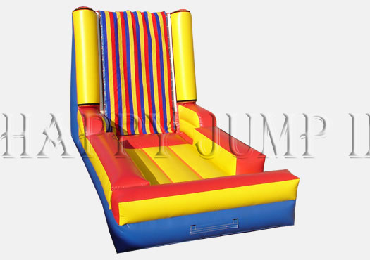 A colorful inflatable slide with an obstacle course.