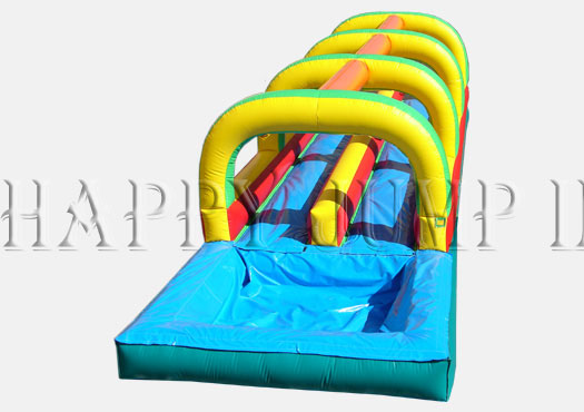 A long inflatable water slide with obstacles.