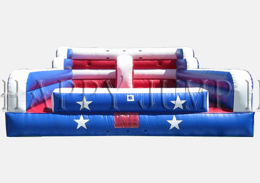 A red white and blue inflatable obstacle course.